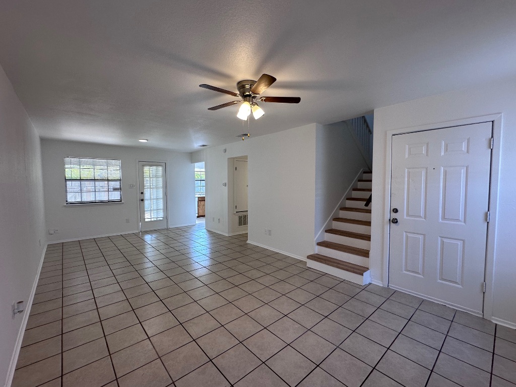 1007 Water Street, Unit 104 Bastrop, TX 78602 - Photo 3 of 23 a view of an empty room with a window
