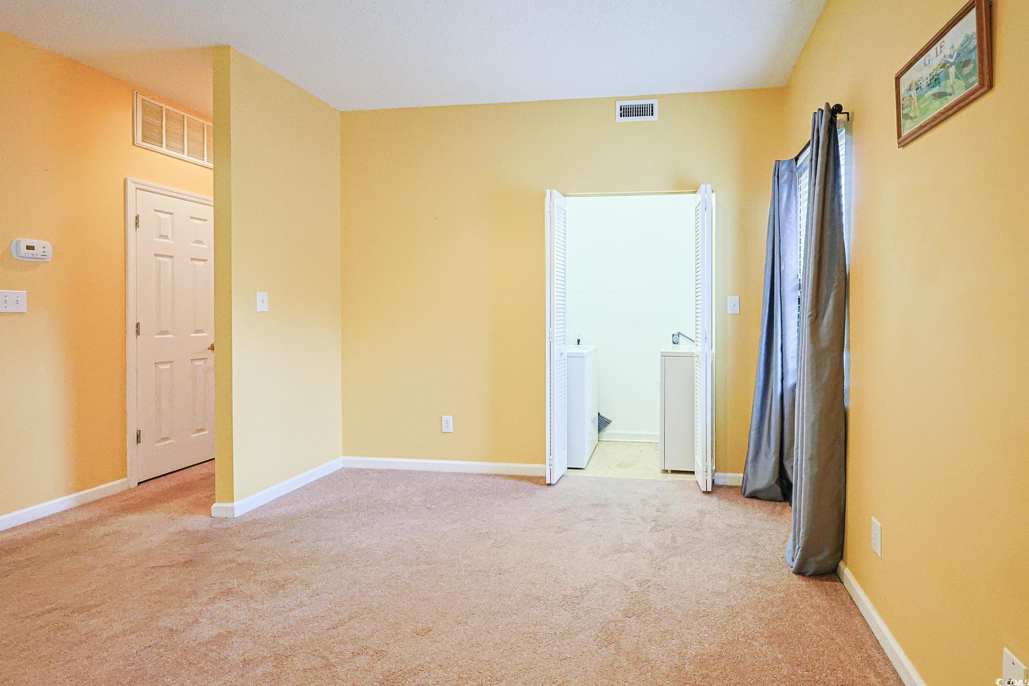 2302 Sweetwater Boulevard, Unit 2302 Murrells Inlet, SC 29576 - Photo 7 of 24 Unfurnished room with light carpet