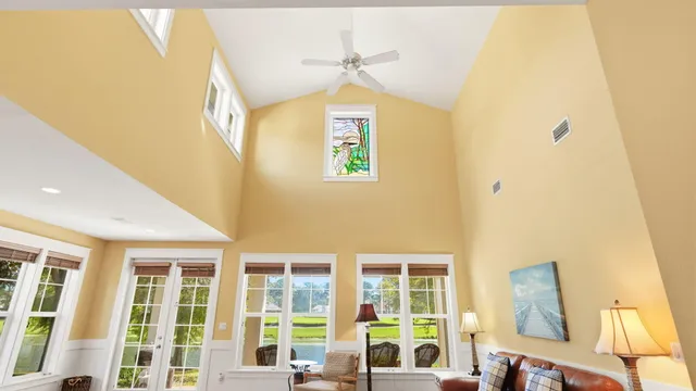 a dining room with furniture and a window