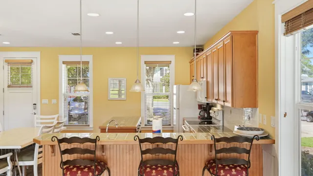 a kitchen that has a sink and a stove in it