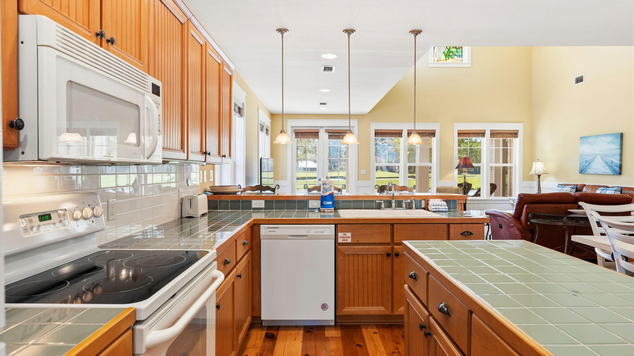 1327 Ravens Run East Miramar Beach, FL 32550 - Photo 19 of 59 a kitchen with a sink a counter top space stainless steel appliances and cabinets