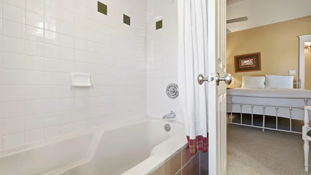 a bed room with a bed and a lamp