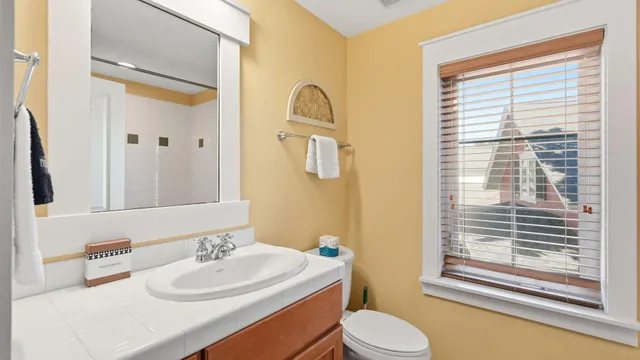 a bedroom with a bed and a flat tv screen