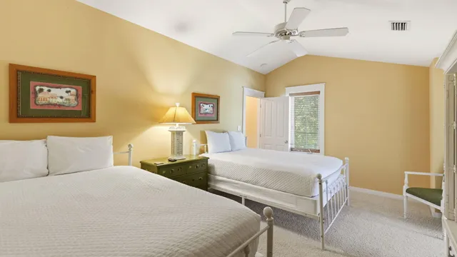 a bedroom with a bed and a night stand