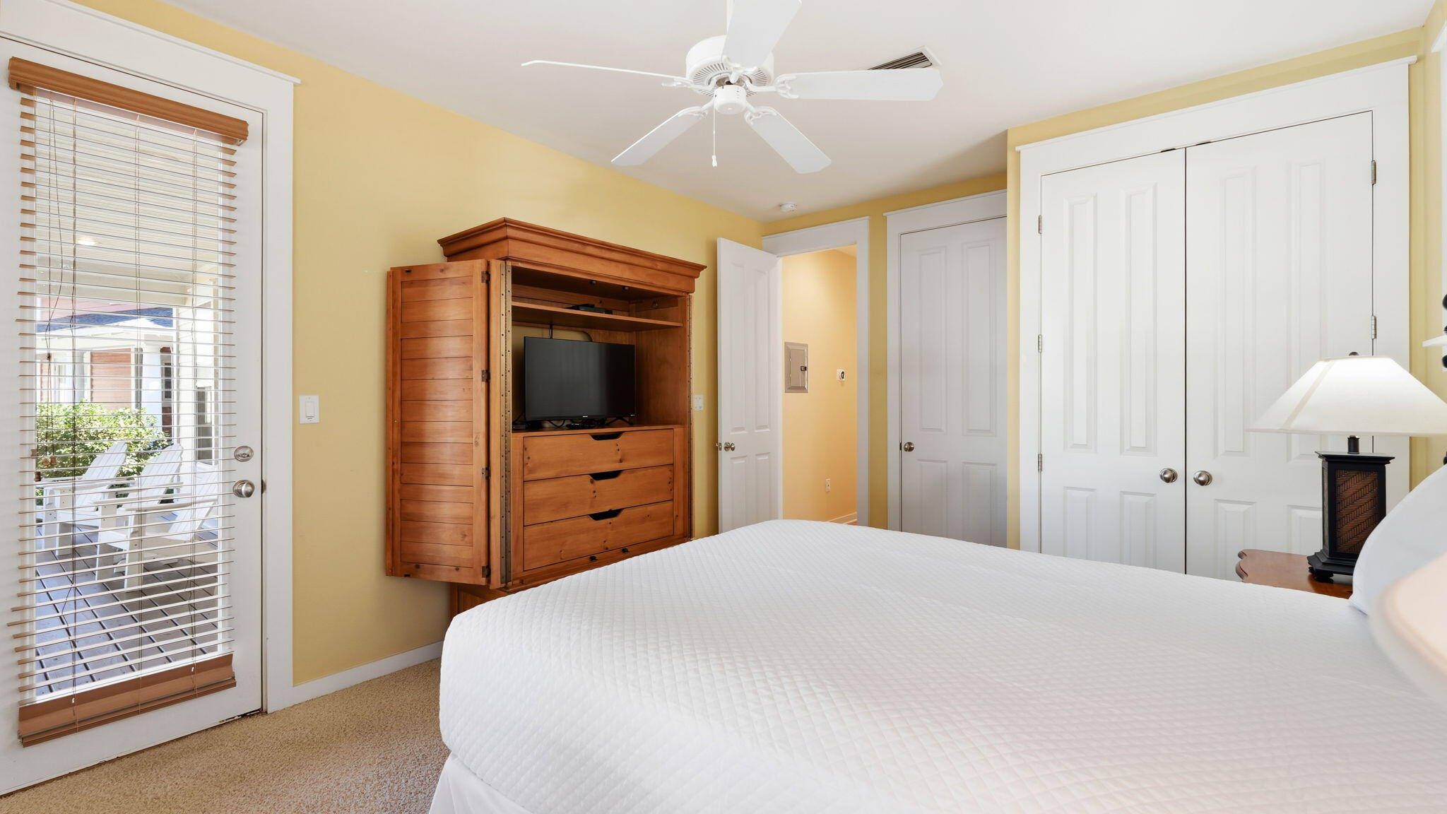 1327 Ravens Run East Miramar Beach, FL 32550 - Photo 28 of 59 a bedroom with a bed and a flat tv screen