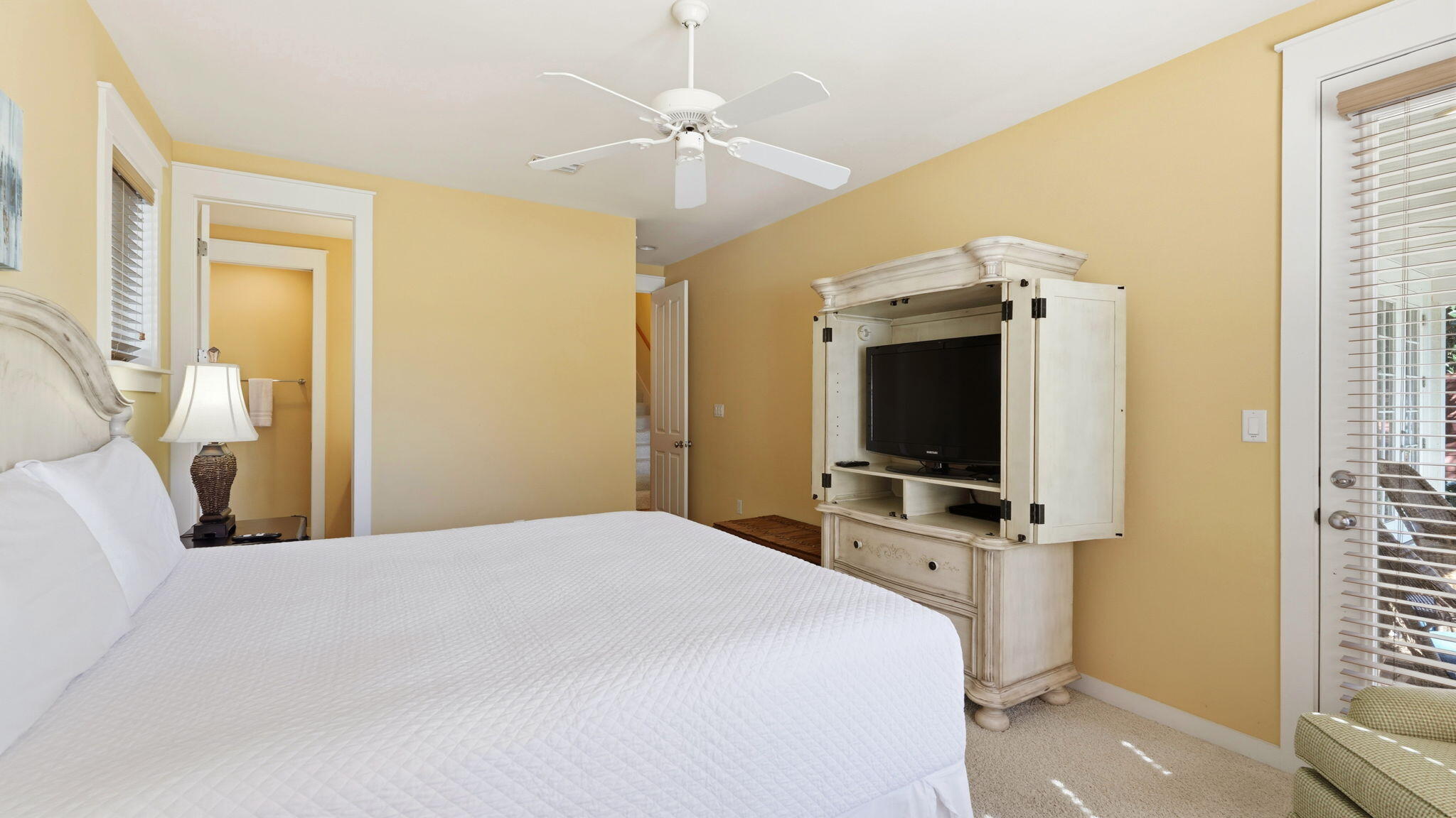 1327 Ravens Run East Miramar Beach, FL 32550 - Photo 35 of 59 a bedroom with a bed and a flat tv screen on dresser