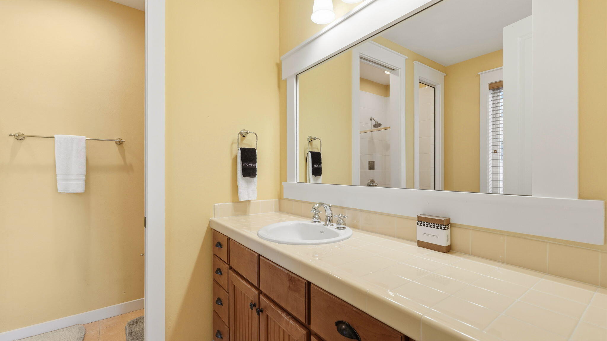 1327 Ravens Run East Miramar Beach, FL 32550 - Photo 36 of 59 a bathroom with a sink and a mirror