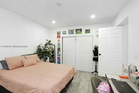 a bedroom with a bed and a dresser