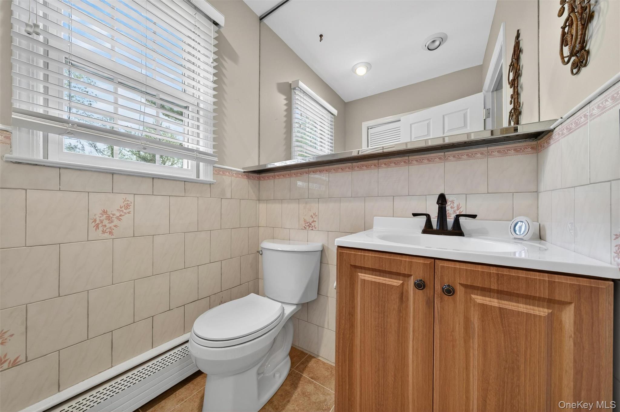 155 Pine Tree Road Monroe, NY 10950 - Photo 21 of 49 a bathroom with a toilet a sink and mirror