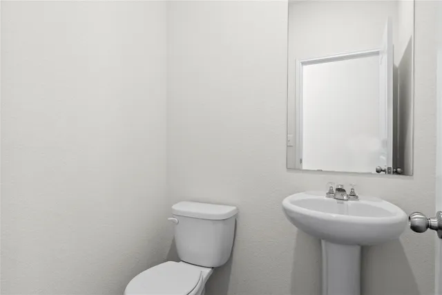 a bathroom with a sink and a toilet