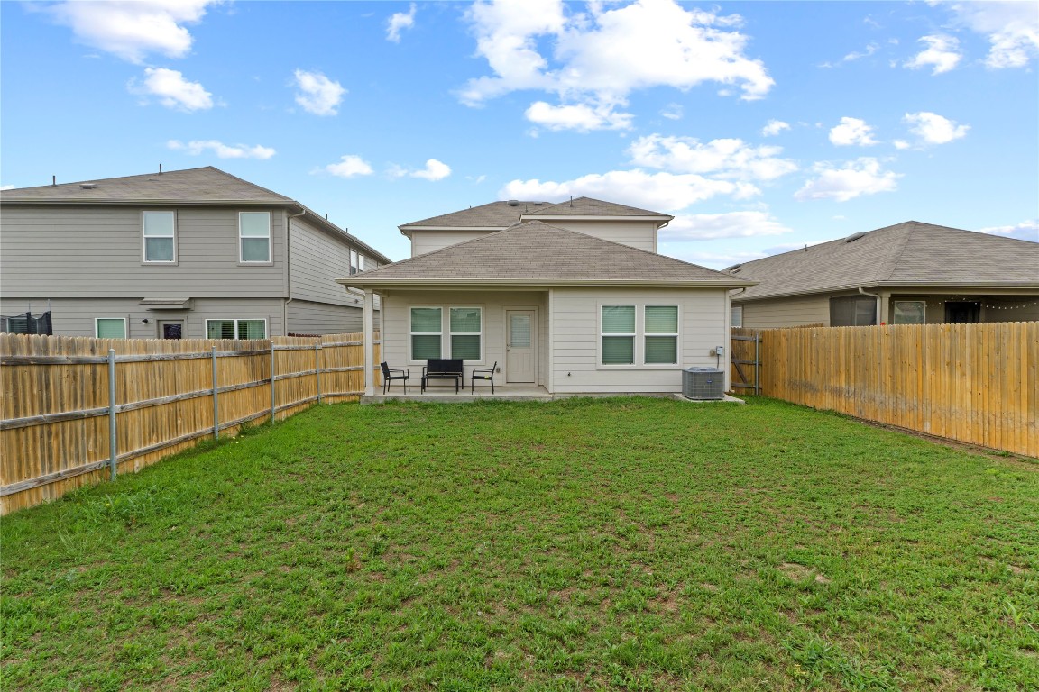 14806 Bajada Road Manor, TX 78653 - Photo 28 of 28 a view of a house with a backyard