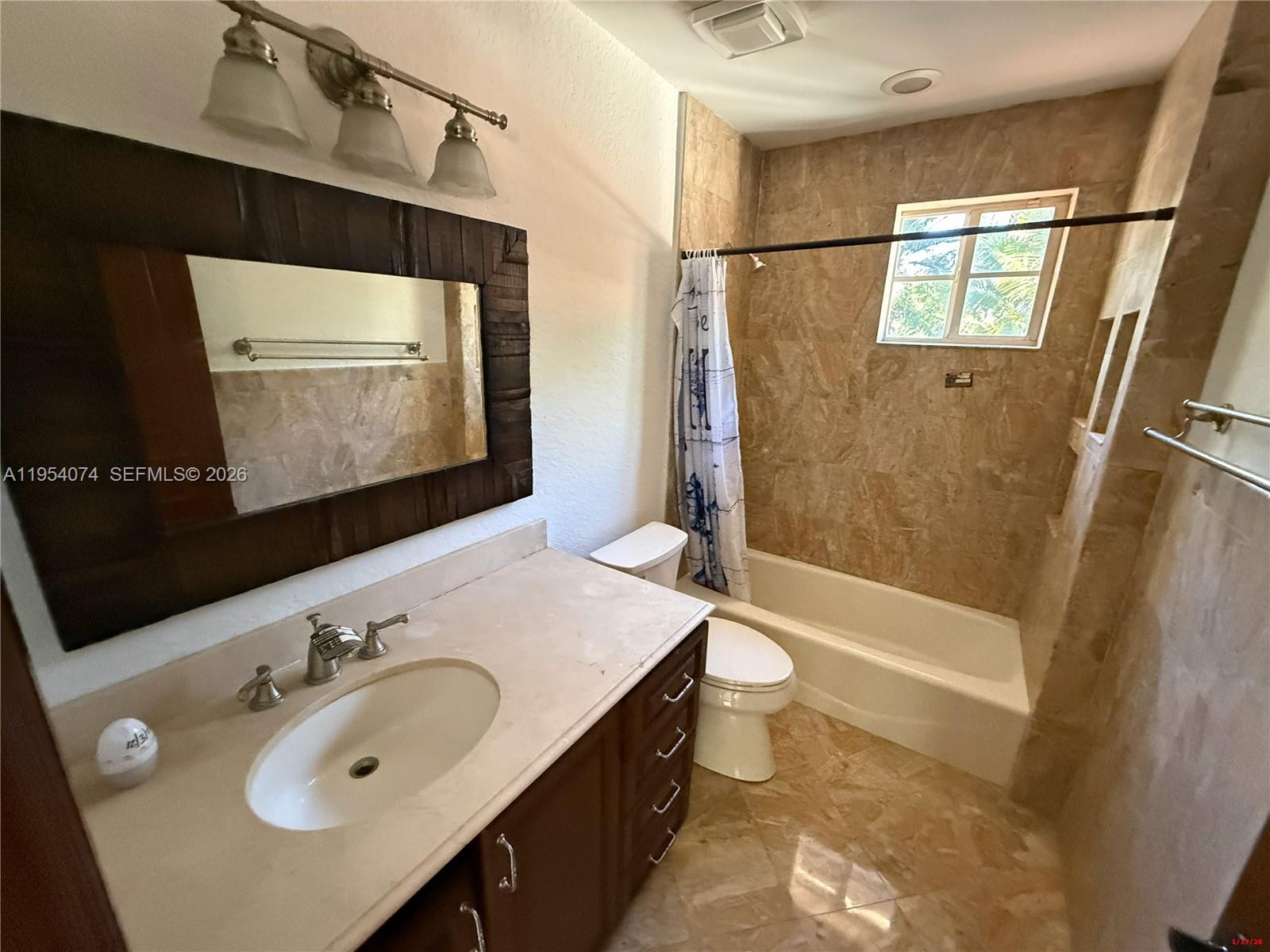 19950 Southwest 228th Street Miami, FL 33170 - Photo 13 of 24 a bathroom with a sink and a mirror