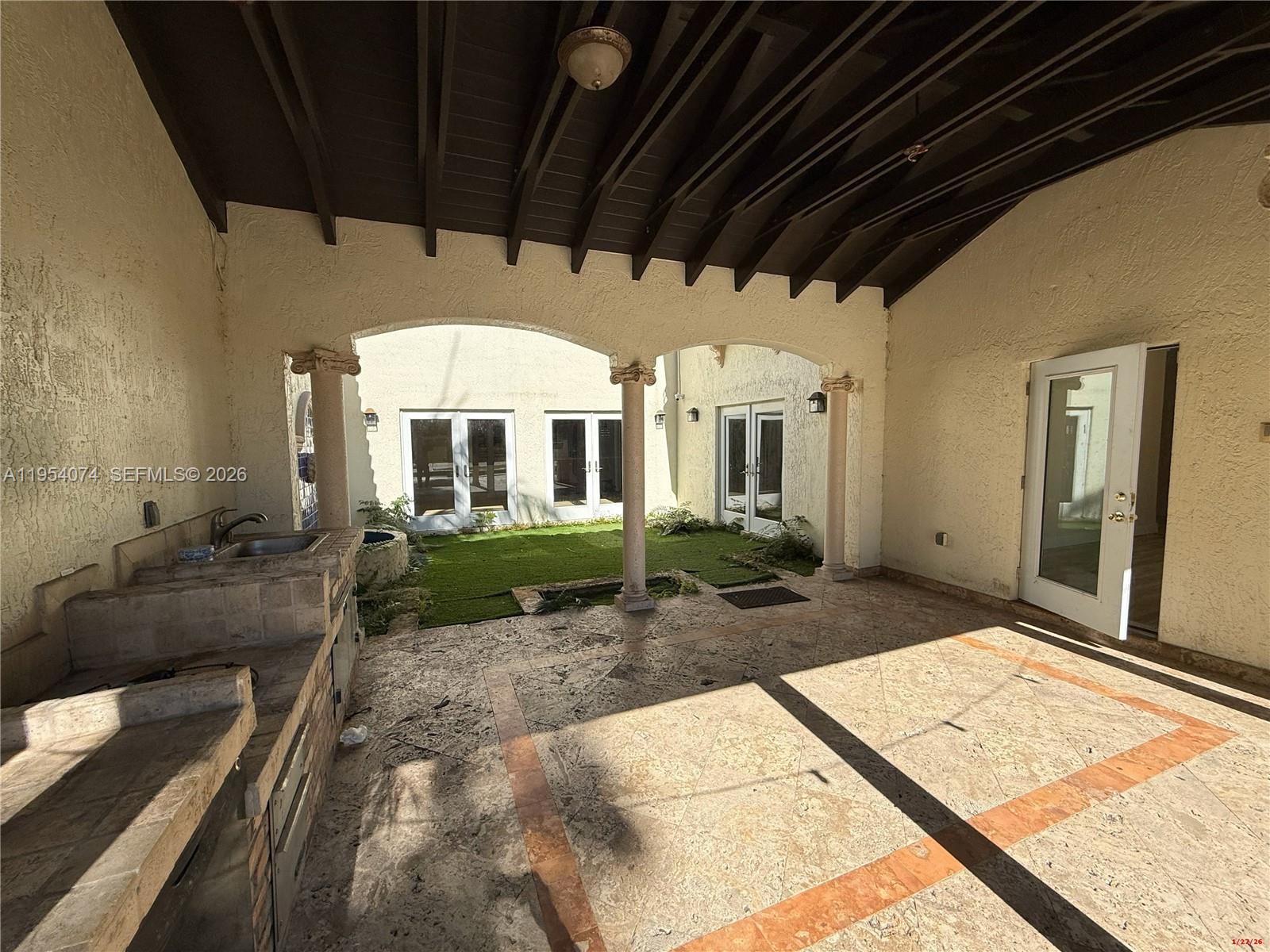 19950 Southwest 228th Street Miami, FL 33170 - Photo 16 of 24 a view of a porch with furniture and a yard