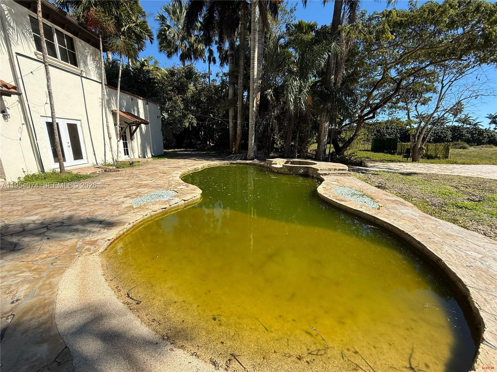 19950 Southwest 228th Street Miami, FL 33170 - Photo 17 of 24 a view of swimming pool with patio