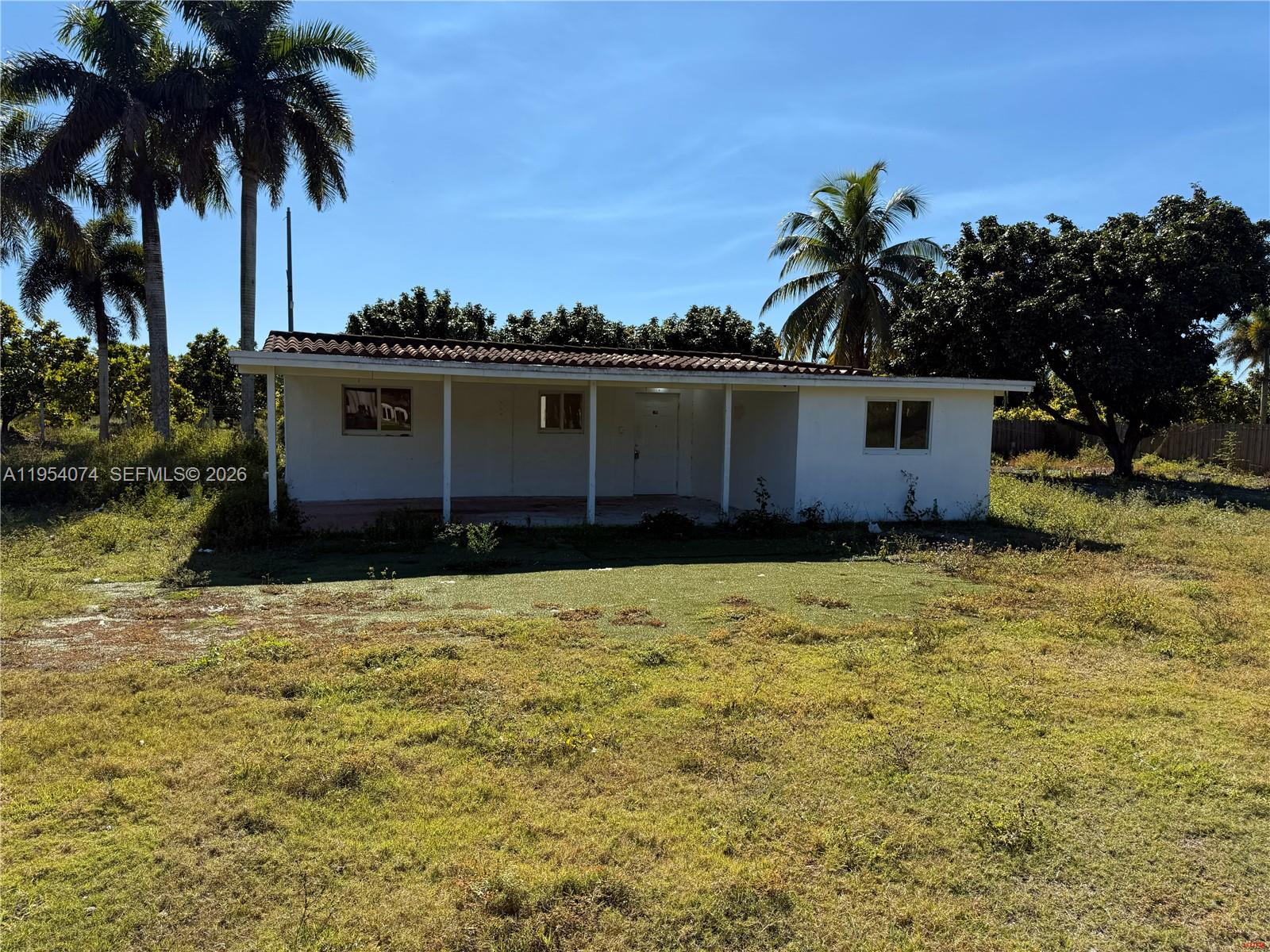 19950 Southwest 228th Street Miami, FL 33170 - Photo 20 of 24 a house view with a garden space