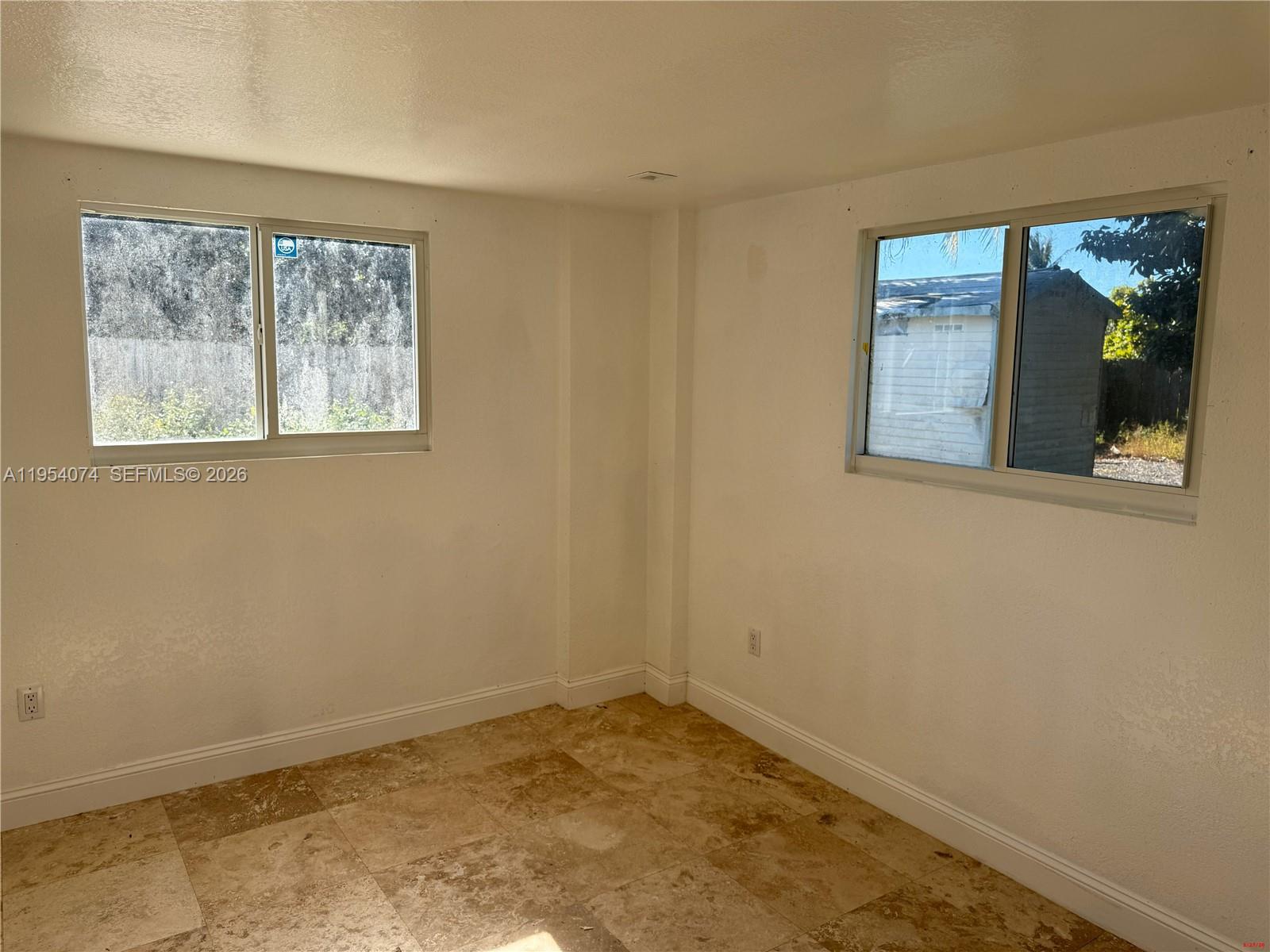 19950 Southwest 228th Street Miami, FL 33170 - Photo 22 of 24 a view of empty room with window