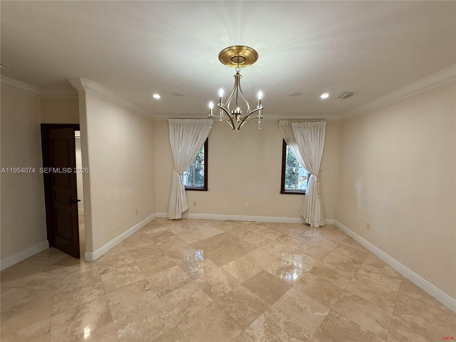 19950 Southwest 228th Street Miami, FL 33170 - Photo 9 of 24 wooden floor in an empty room with a window