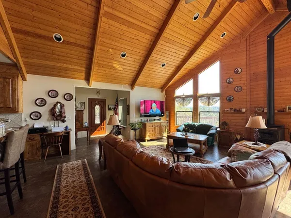 a bed room with a bed and a tv