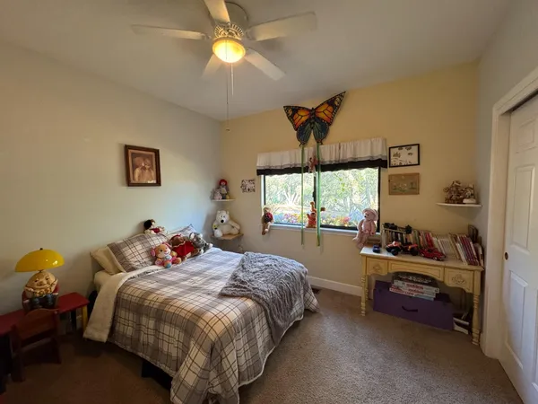 a bathroom with a sink a toilet a mirror and shower