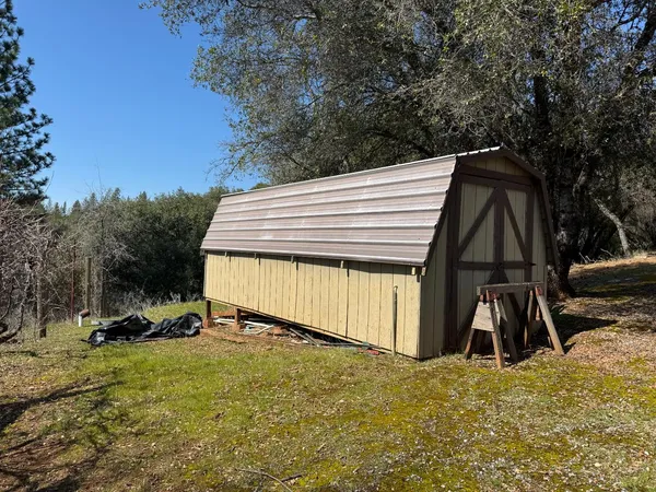 a bed room with a bed window and a table