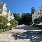 a view of a street with a building in the background
