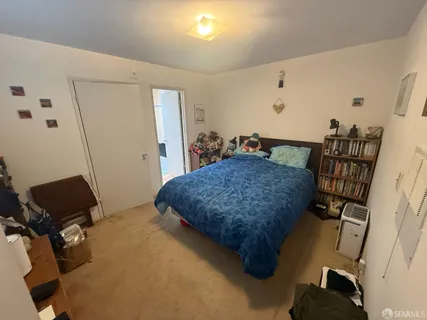a bedroom with a bed and furniture