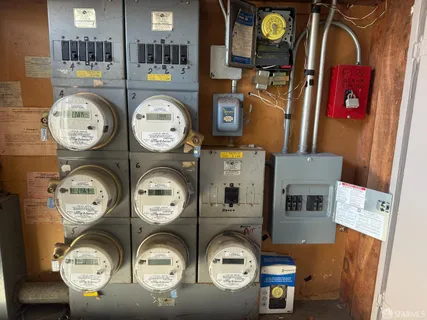 a clock on a wall next to a wooden table