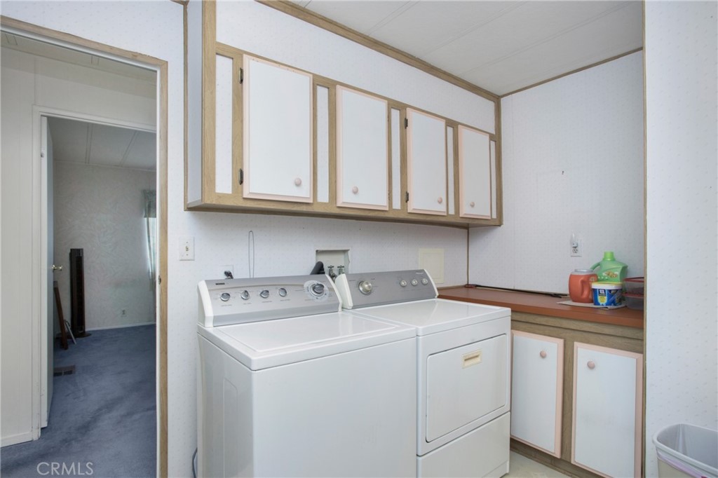 692 North Adele Street, Unit 49 Orange, CA 92867 - Photo 13 of 16 a utility room with stainless steel appliances granite countertop a sink dishwasher and cabinets with wooden floor