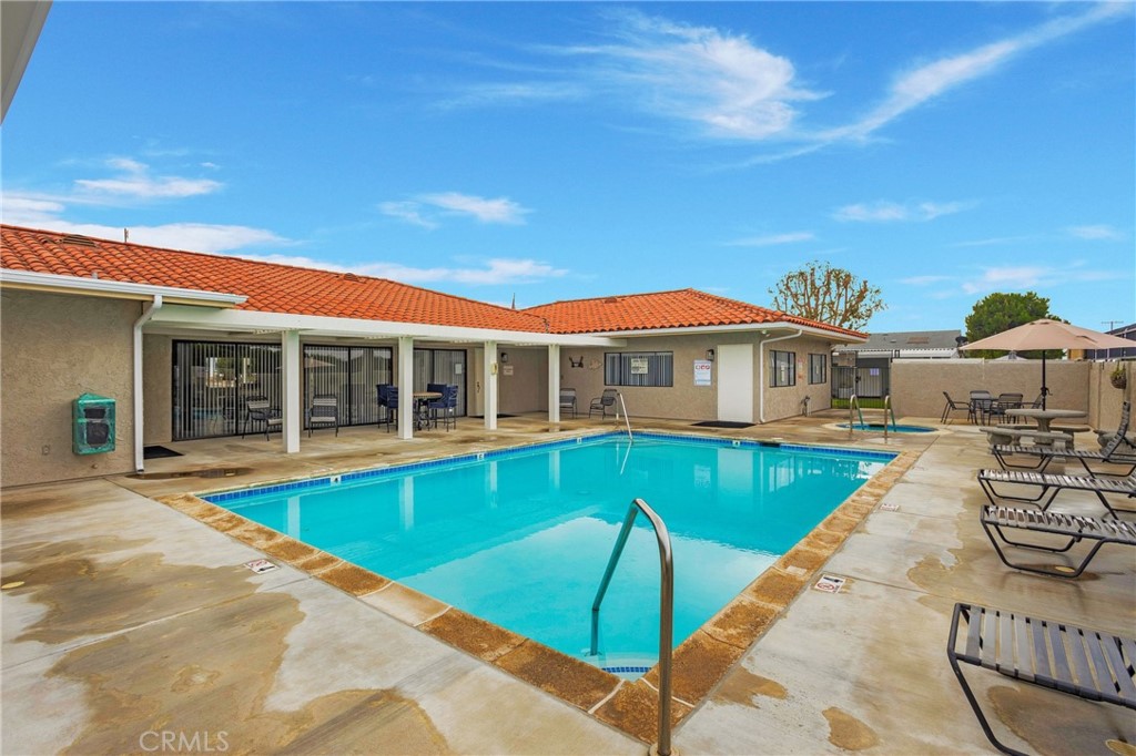 692 North Adele Street, Unit 49 Orange, CA 92867 - Photo 15 of 16 a front view of a house with swimming pool