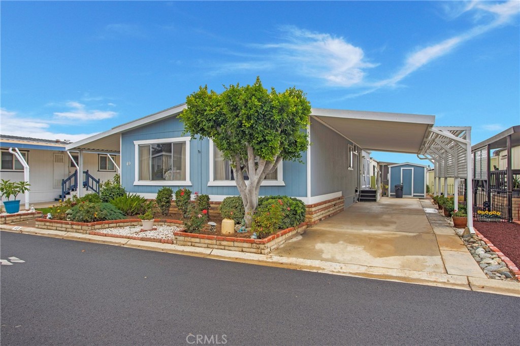 692 North Adele Street, Unit 49 Orange, CA 92867 - Photo 2 of 16 a house with palm tree in front of it