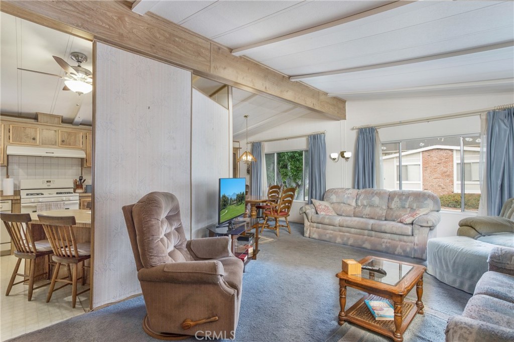 692 North Adele Street, Unit 49 Orange, CA 92867 - Photo 4 of 16 a living room with furniture and a large window