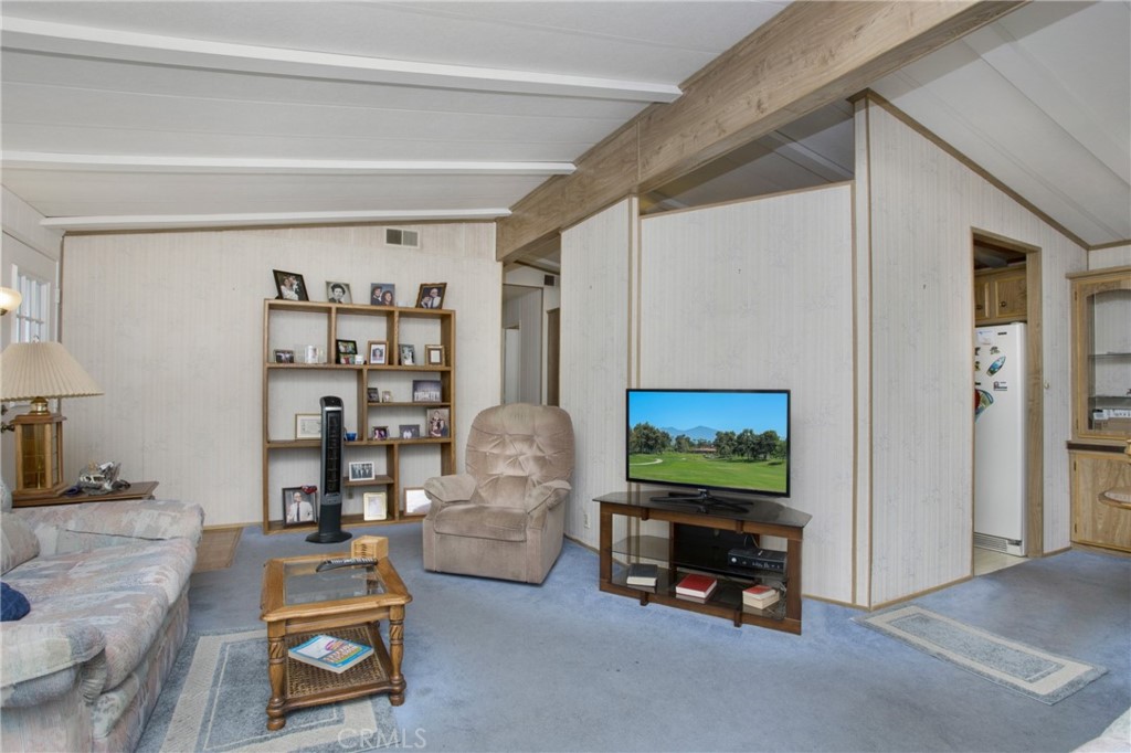 692 North Adele Street, Unit 49 Orange, CA 92867 - Photo 5 of 16 a living room with furniture and a flat screen tv