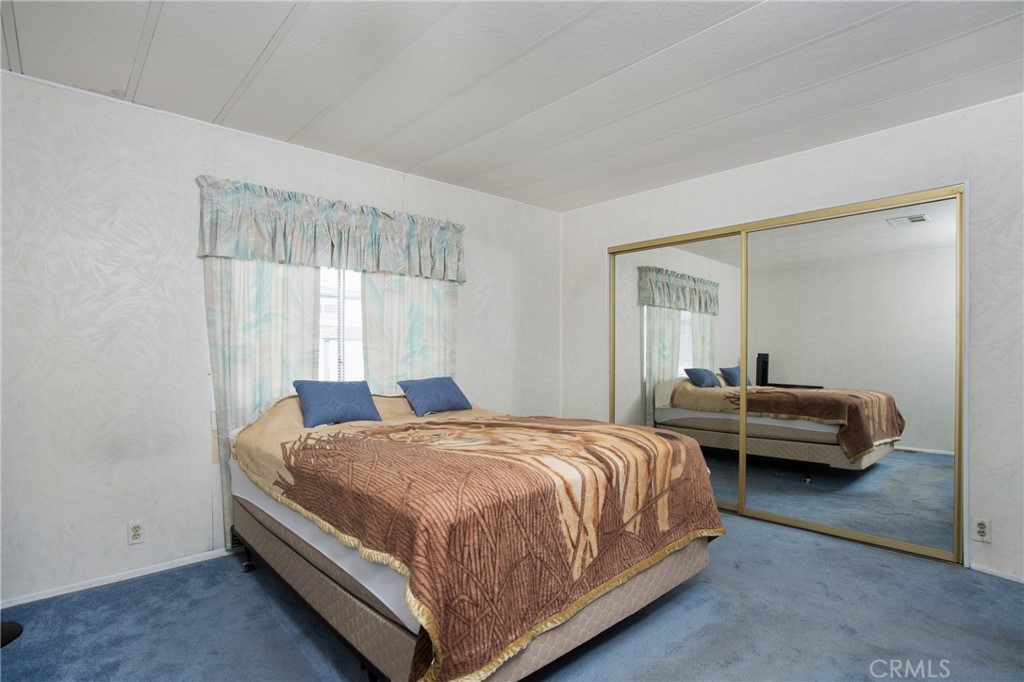692 North Adele Street, Unit 49 Orange, CA 92867 - Photo 8 of 16 a bedroom with a bed and a window