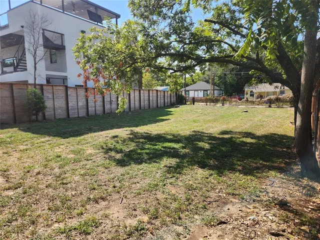 a view of backyard with green space