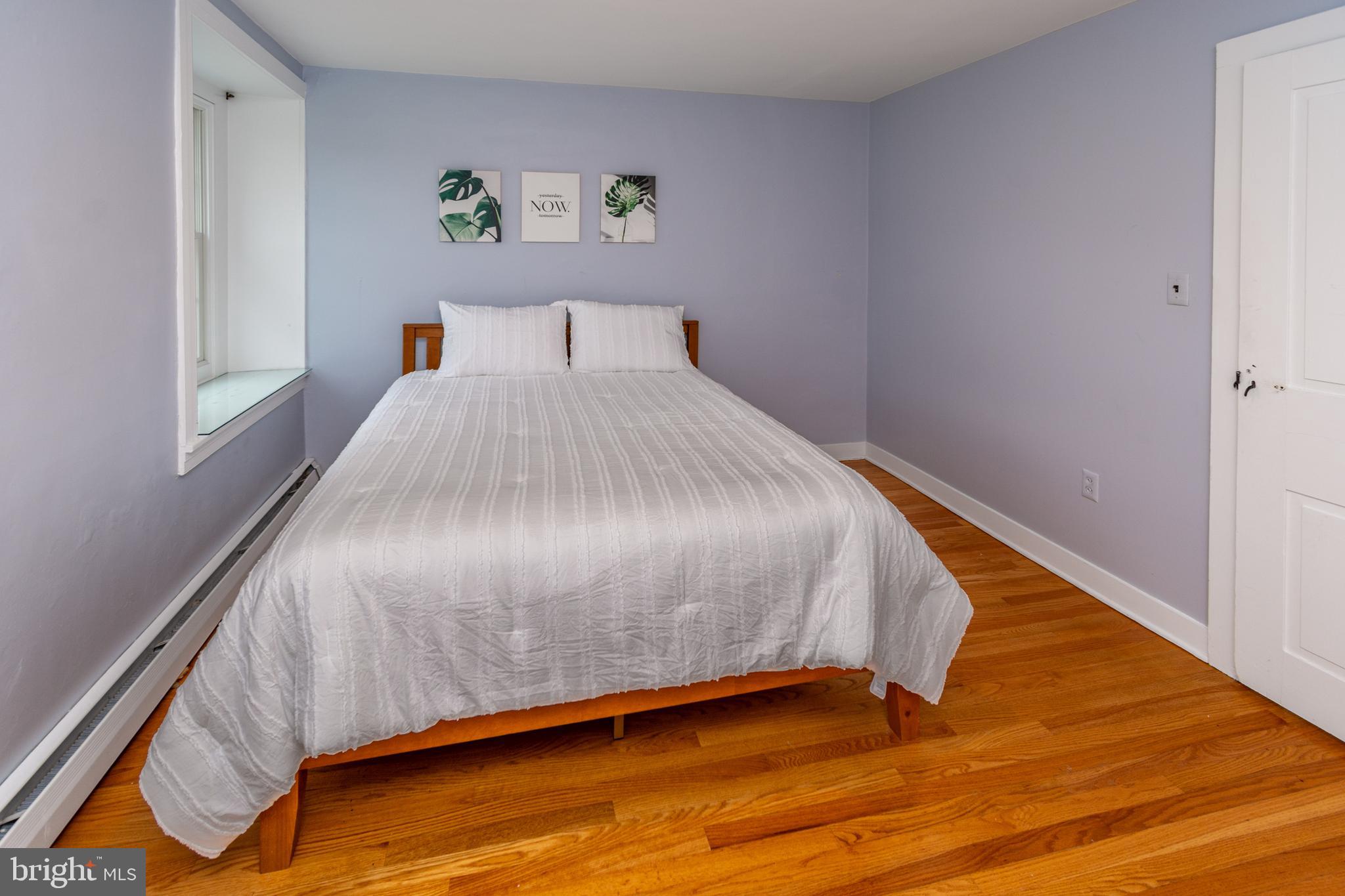 180 Municipal Road Pipersville, PA 18947 - Photo 48 of 60 a bed sitting in a bedroom next to a window
