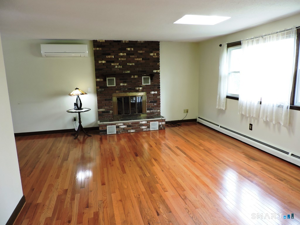 269 Griffin Road South Windsor, CT 06074 - Photo 13 of 36 wooden floor in an empty room with a window