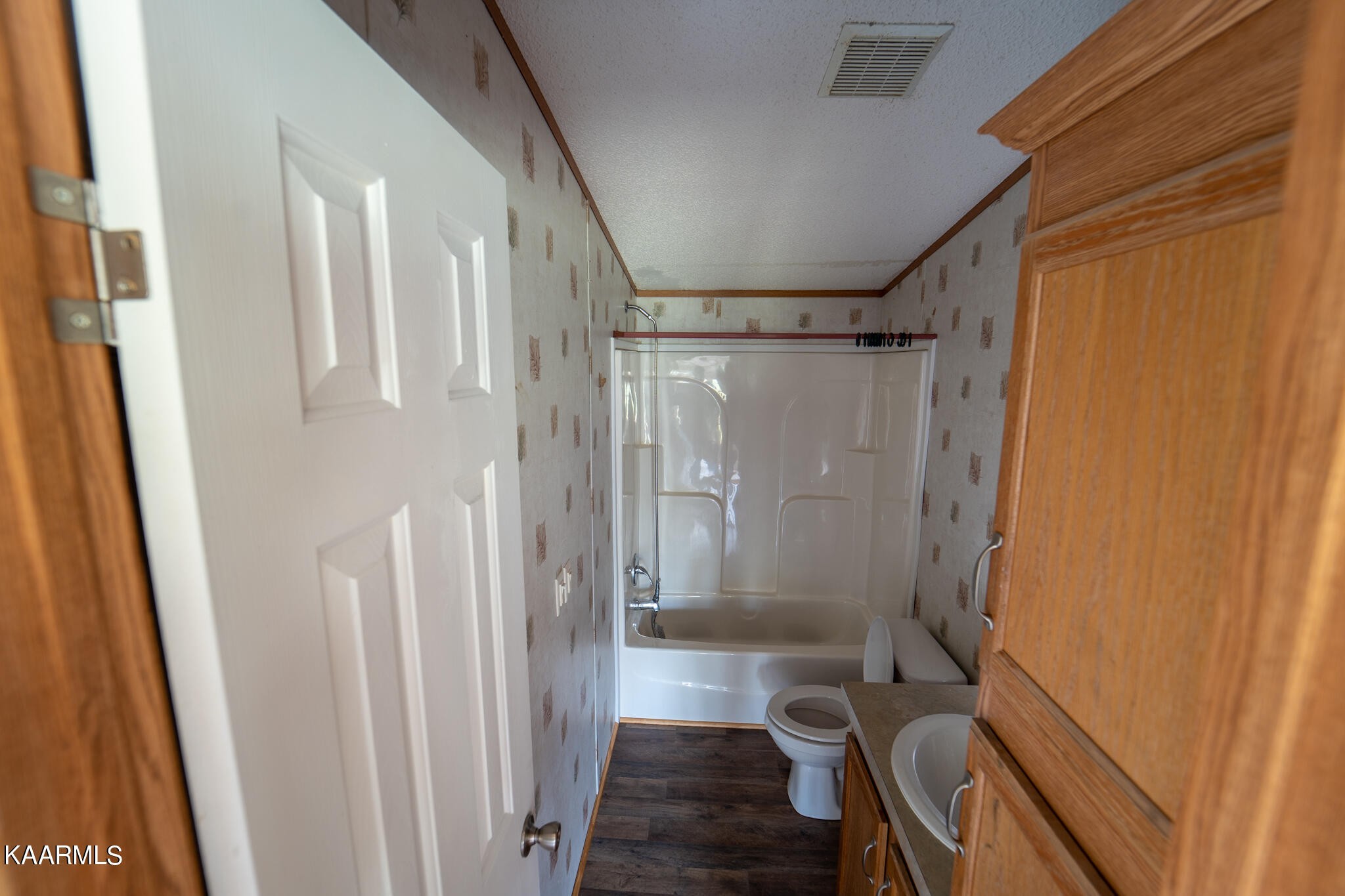 560 Meadowview Road Mosheim, TN 37818 - Photo 10 of 23 a bathroom with a shower and a toilet