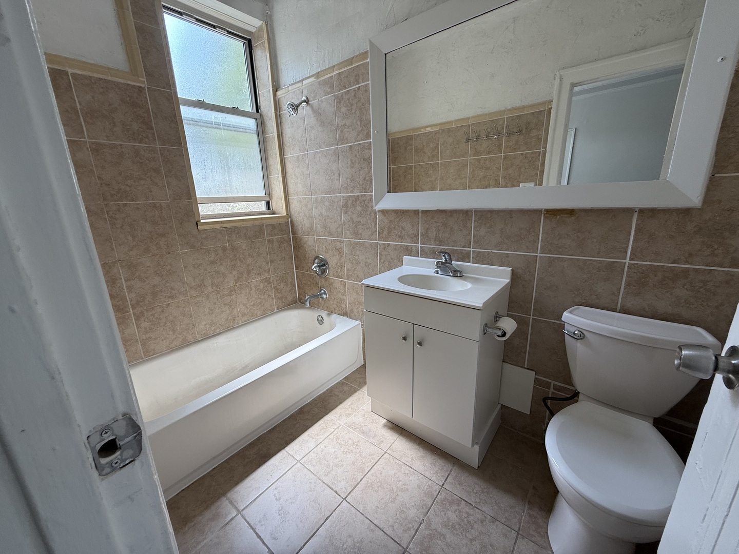 3420 West Irving Park Road, Unit 24 Chicago, IL 60618 - Photo 6 of 6 a bathroom with a sink toilet and tub