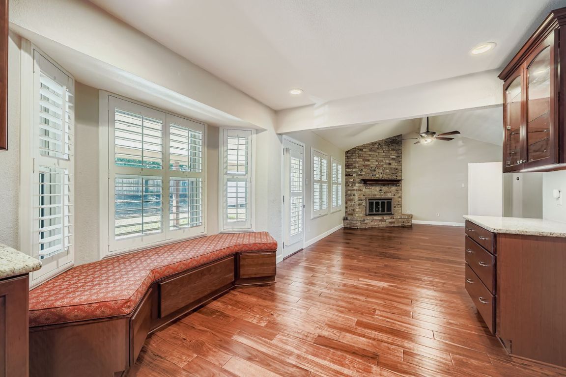 7202 Beckett Road Austin, TX 78749 - Photo 11 of 28 a room with furniture and a wooden floor