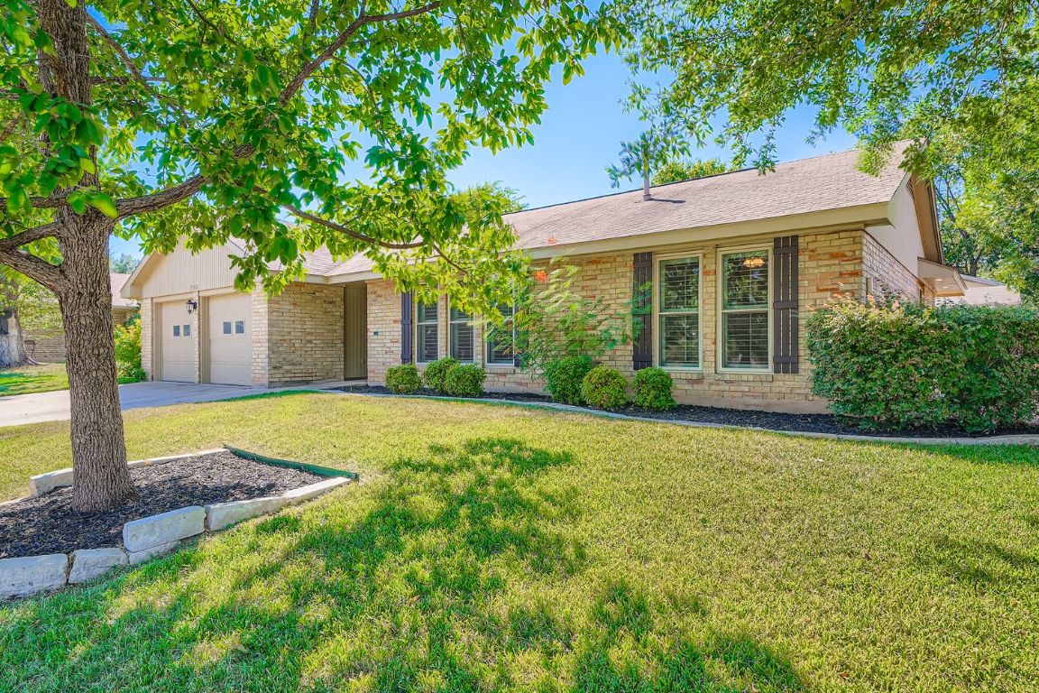 7202 Beckett Road Austin, TX 78749 - Photo 2 of 28 a view of a house with yard and tree s