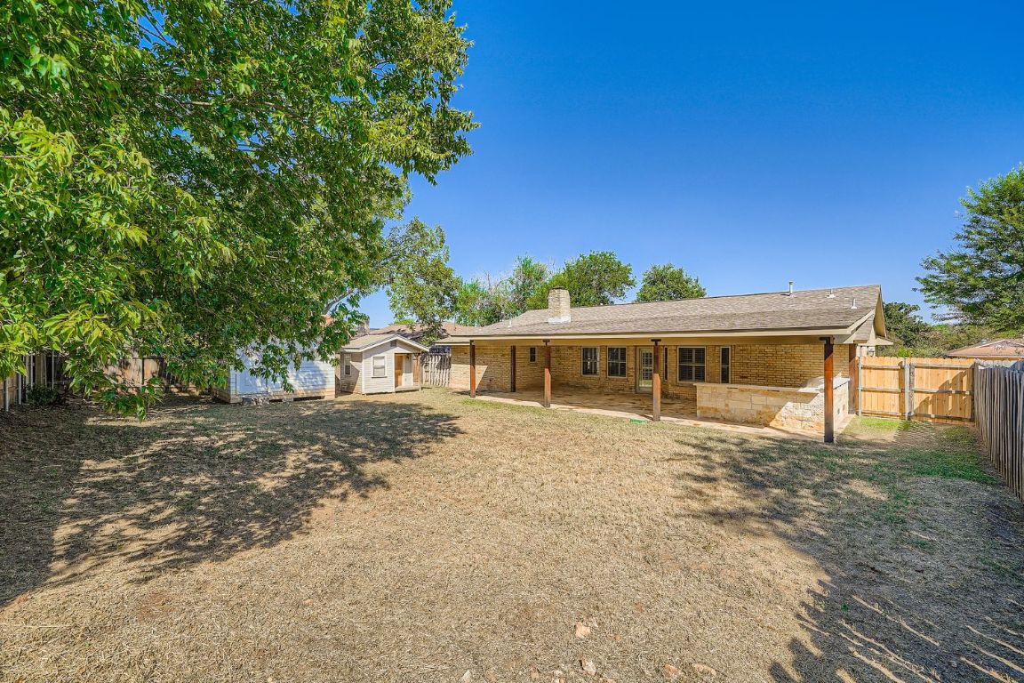 7202 Beckett Road Austin, TX 78749 - Photo 26 of 28 a front view of a house with a garden