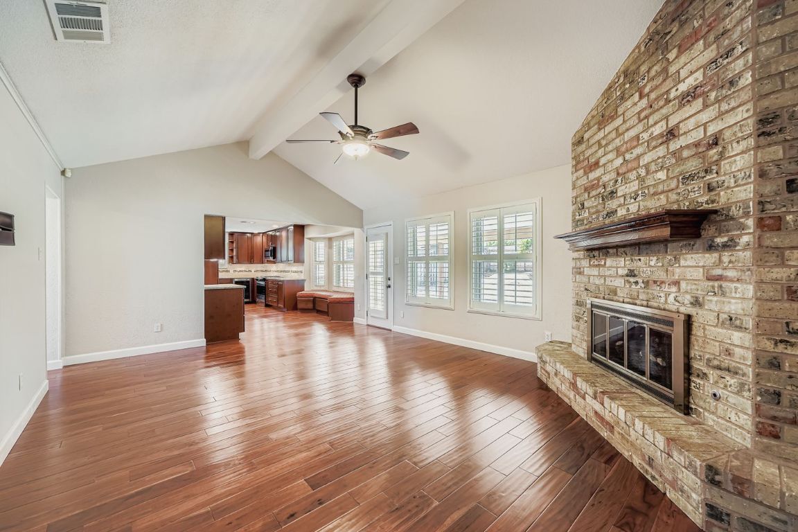 7202 Beckett Road Austin, TX 78749 - Photo 5 of 28 a living room with furniture fireplace and wooden floor
