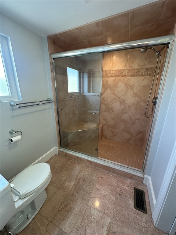 17 Herbert Road, Unit 1 Arlington, MA 02474 - Photo 25 of 26 a bathroom with a toilet and a shower