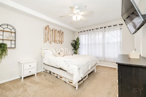 a bed room with a bed and a window