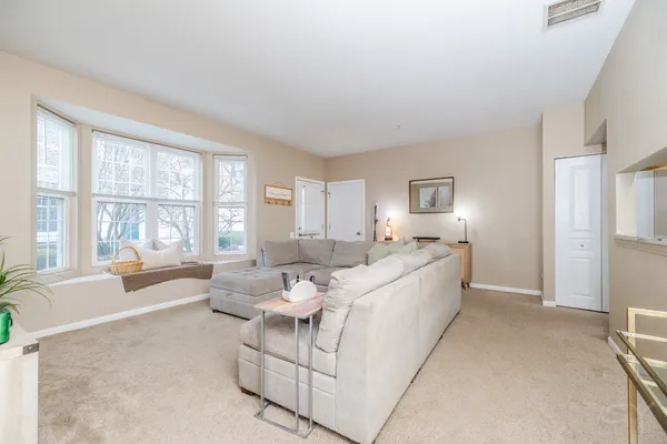 a living room with furniture and a large window