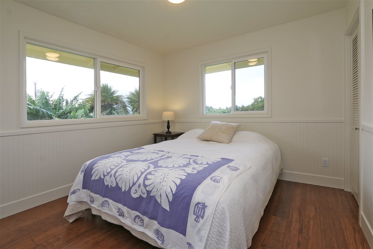 1855 B Kauhikoa Road Haiku, HI 96708 - Photo 15 of 30 a bedroom with a bed and a window