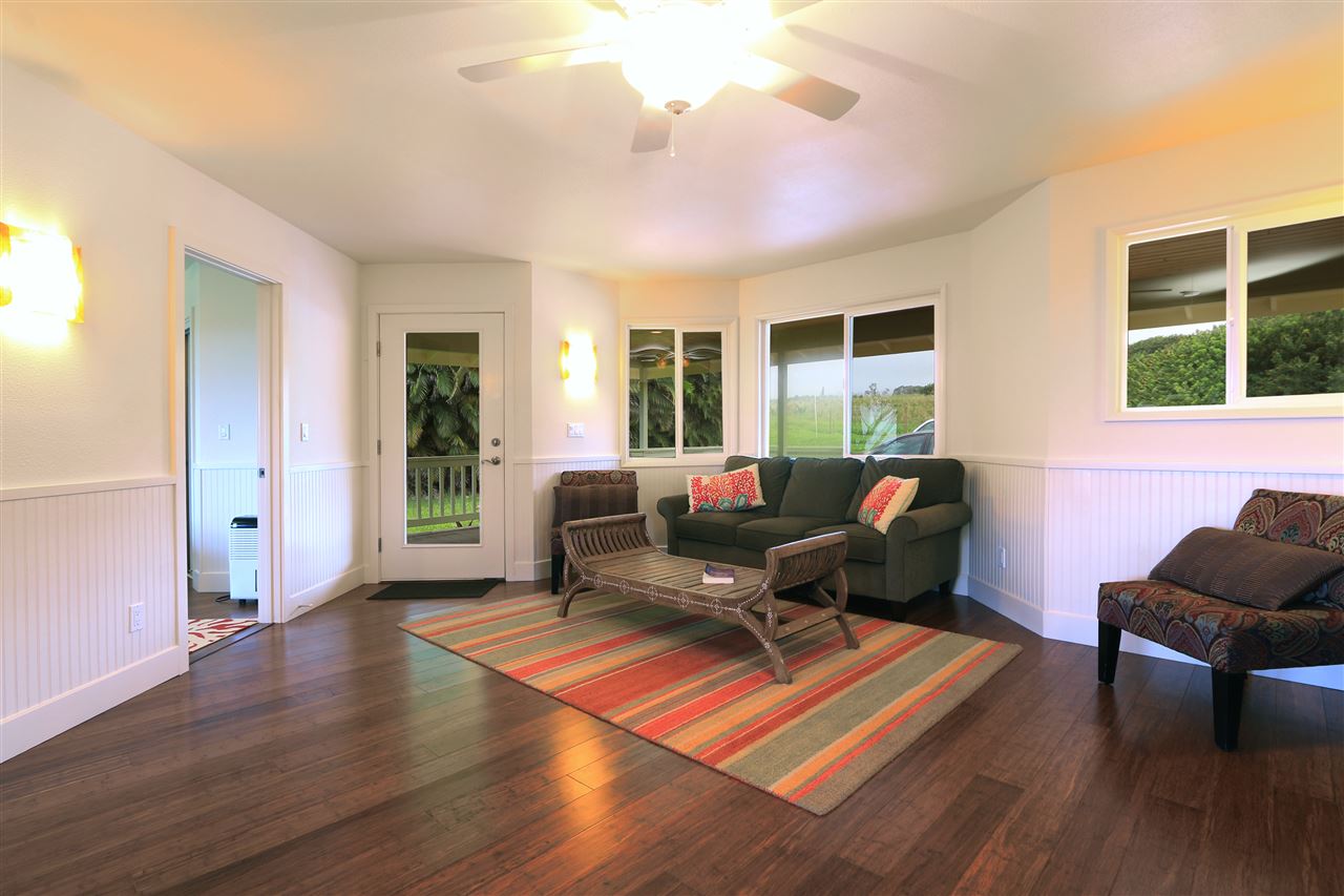 1855 B Kauhikoa Road Haiku, HI 96708 - Photo 16 of 30 a living room with furniture windows and wooden floor