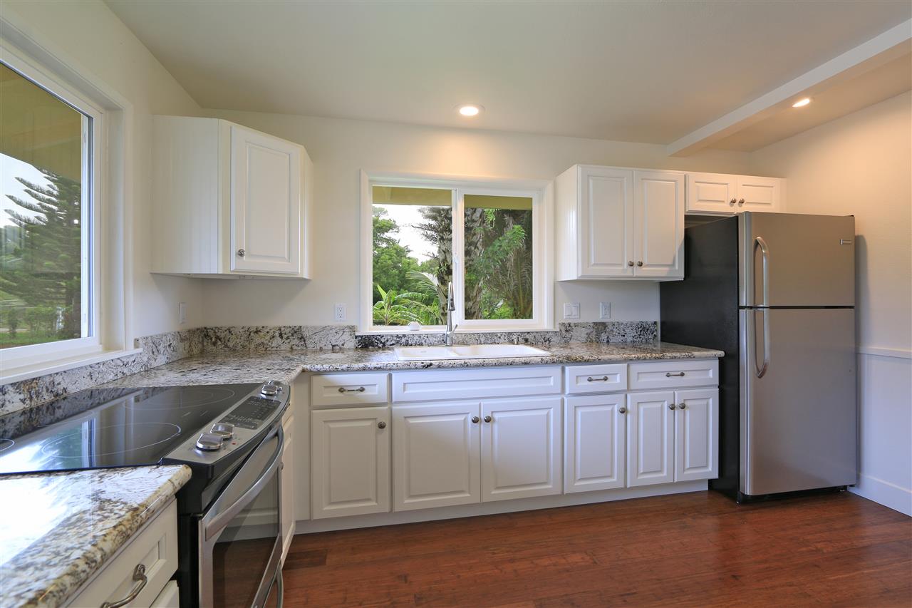 1855 B Kauhikoa Road Haiku, HI 96708 - Photo 19 of 30 a kitchen with a sink stove and refrigerator