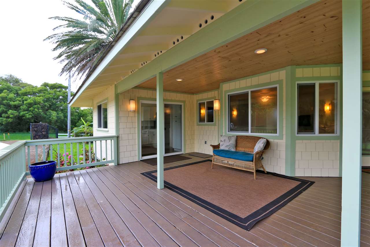 1855 B Kauhikoa Road Haiku, HI 96708 - Photo 26 of 30 a patio with lawn chairs and wooden floor