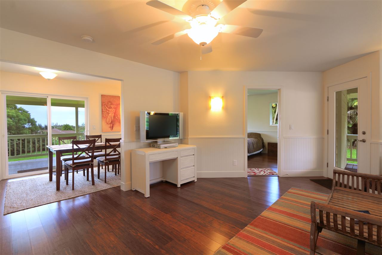 1855 B Kauhikoa Road Haiku, HI 96708 - Photo 5 of 30 a living room with furniture a flat screen tv and a large window